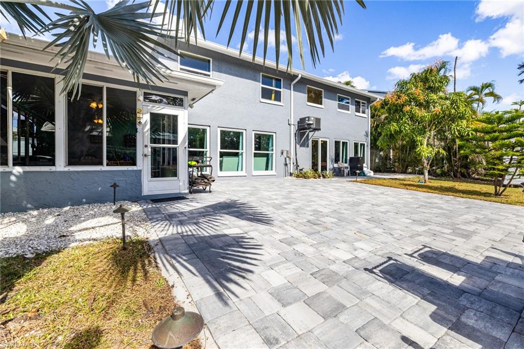 4817-4819 Gary Road Bonita Springs, FL 34134 - Photo 27 of 48 a view of a house with backyard and sitting area