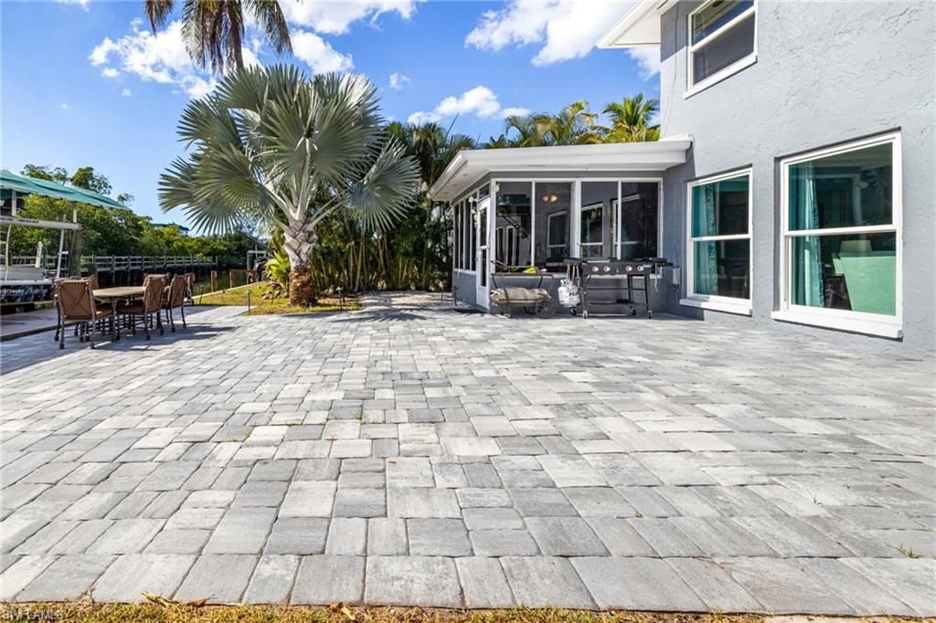 4817-4819 Gary Road Bonita Springs, FL 34134 - Photo 28 of 48 a view of a house with backyard porch and sitting area