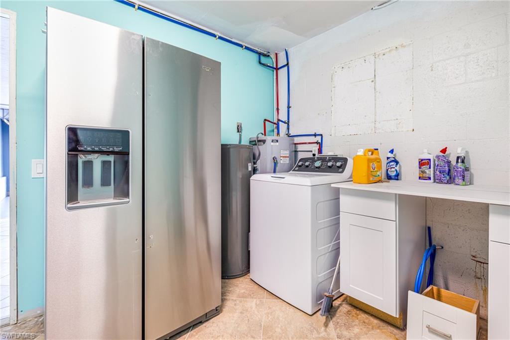 4817-4819 Gary Road Bonita Springs, FL 34134 - Photo 41 of 48 a view of storage and utility room with washer and dryer