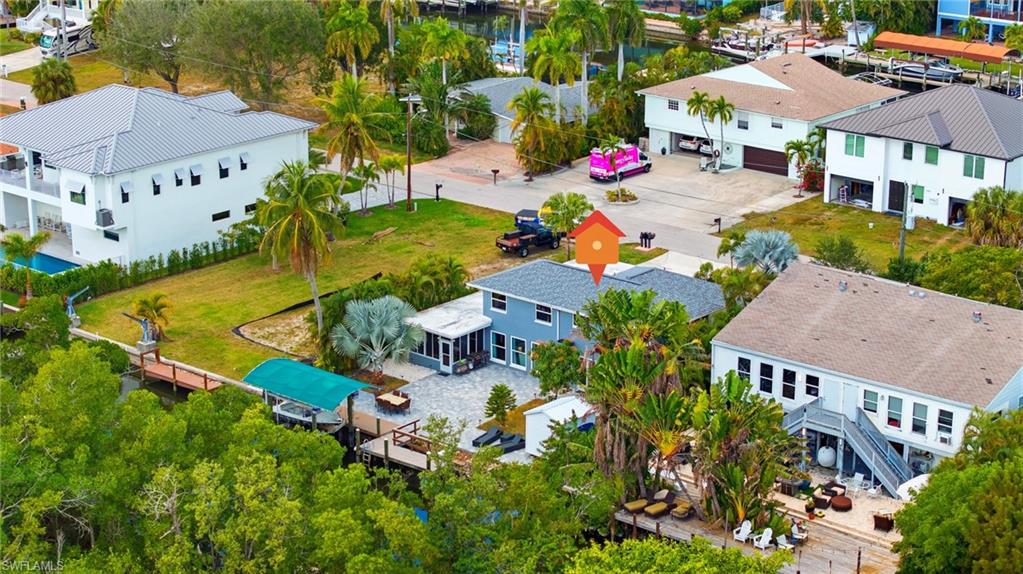 4817-4819 Gary Road Bonita Springs, FL 34134 - Photo 47 of 48 an aerial view of multiple houses with yard