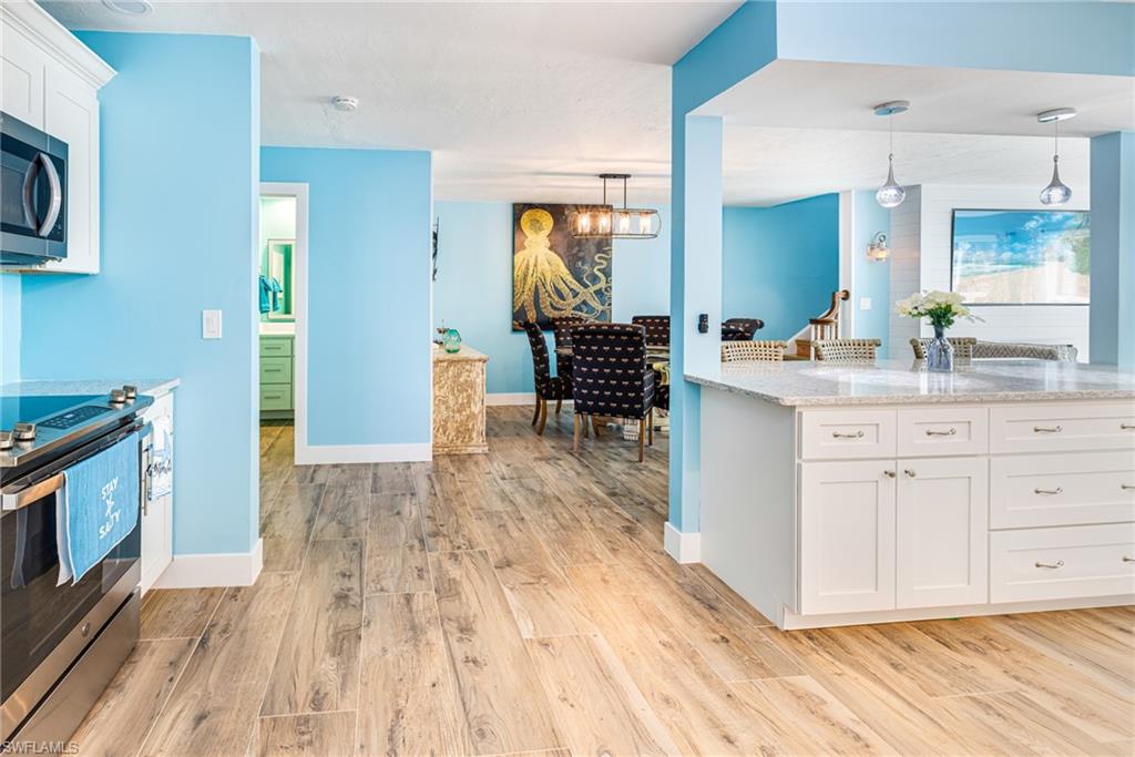 4817-4819 Gary Road Bonita Springs, FL 34134 - Photo 10 of 48 a view of a kitchen counter space and wooden floor