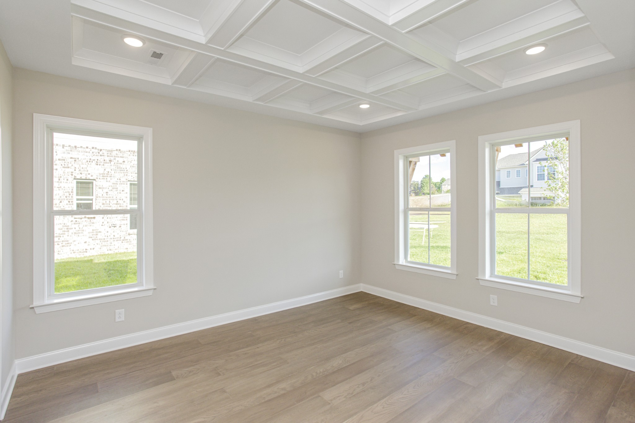 7005 Thunderhead Way Spring Hill, TN 37174 - Photo 11 of 63 a view of an empty room with wooden floor and windows