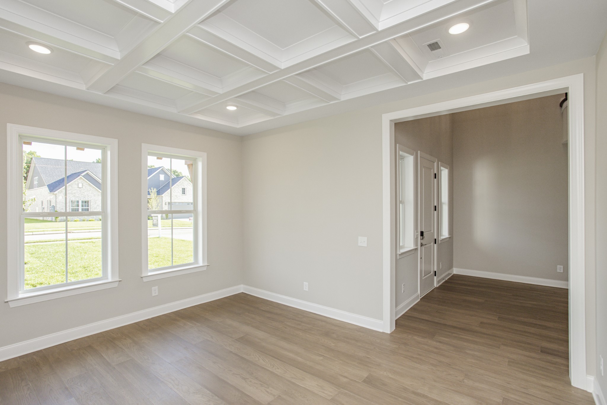 7005 Thunderhead Way Spring Hill, TN 37174 - Photo 12 of 63 a view of an empty room with wooden floor and a window