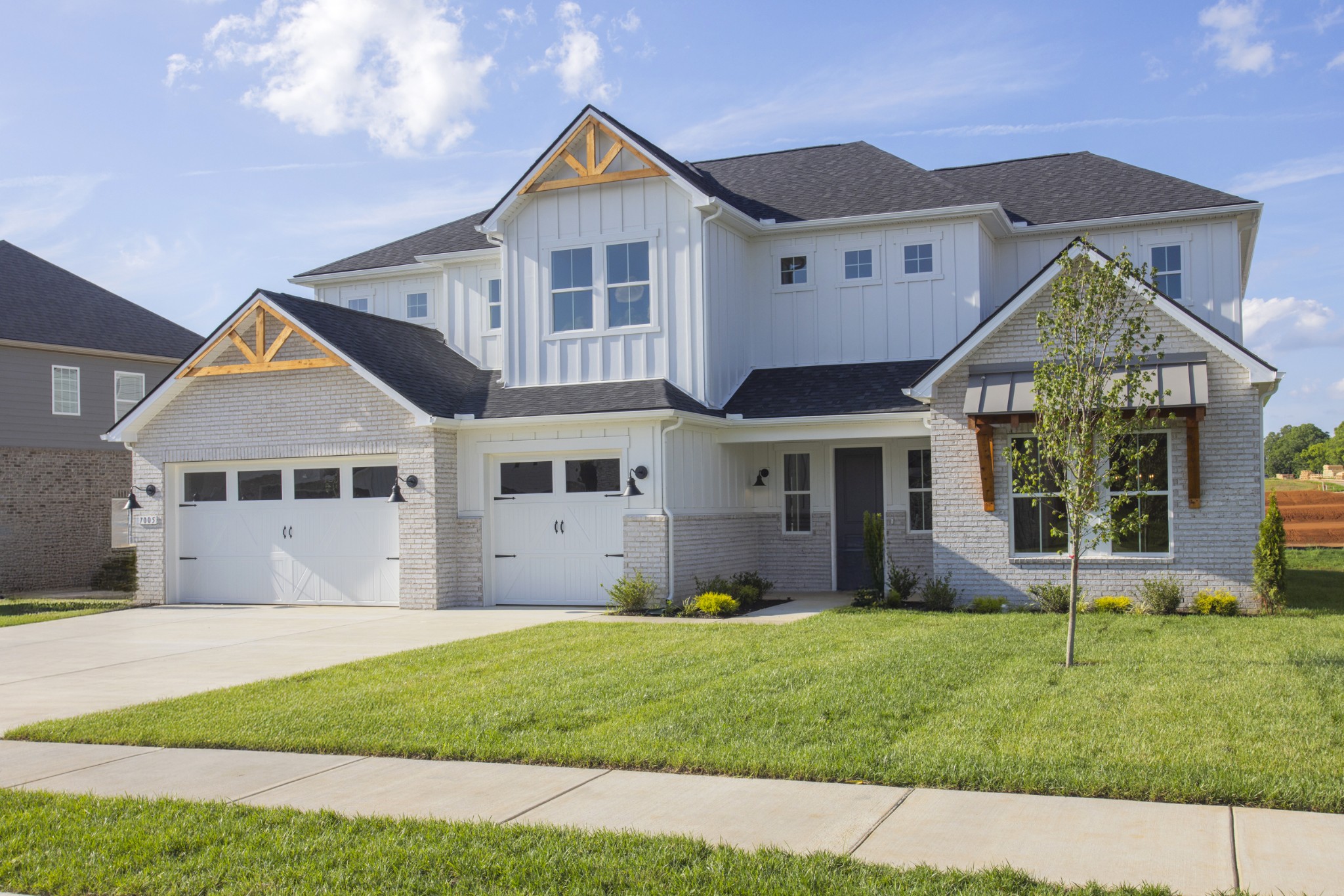 7005 Thunderhead Way Spring Hill, TN 37174 - Photo 2 of 63 a front view of a house with a yard and garage