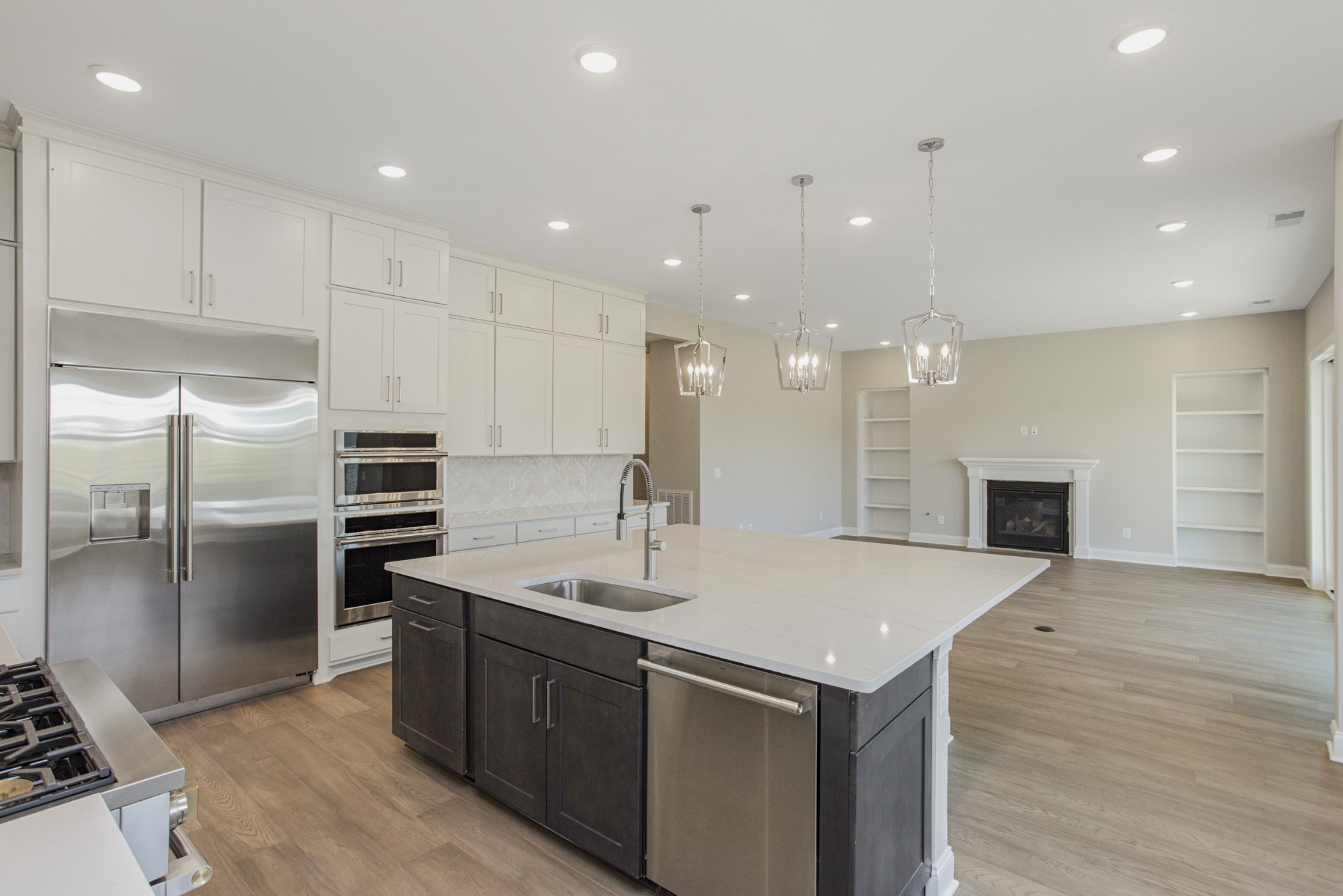 7005 Thunderhead Way Spring Hill, TN 37174 - Photo 29 of 63 a kitchen with a sink stainless steel appliances and cabinets