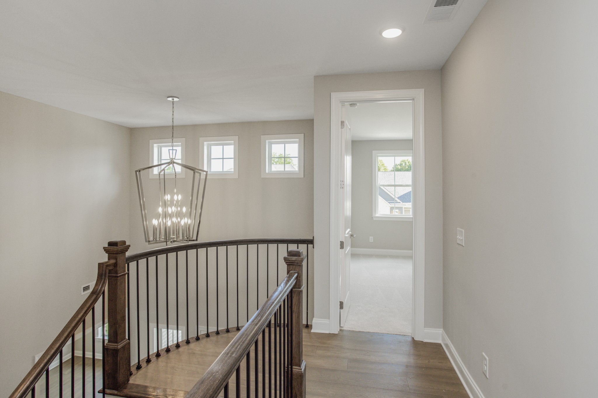 7005 Thunderhead Way Spring Hill, TN 37174 - Photo 38 of 63 a view of a hallway with wooden floor and staircase