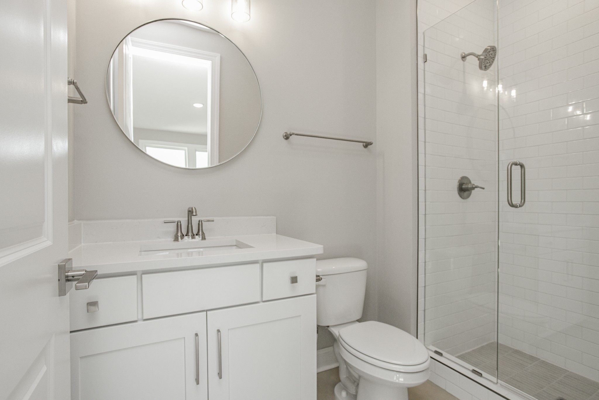7005 Thunderhead Way Spring Hill, TN 37174 - Photo 56 of 63 a bathroom with a toilet sink vanity granite and shower