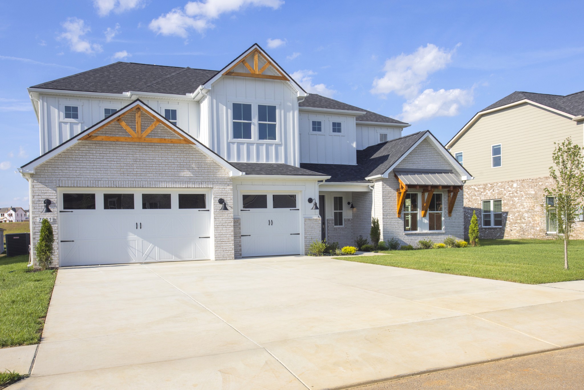 7005 Thunderhead Way Spring Hill, TN 37174 - Photo 9 of 63 a front view of a house with a yard and garage