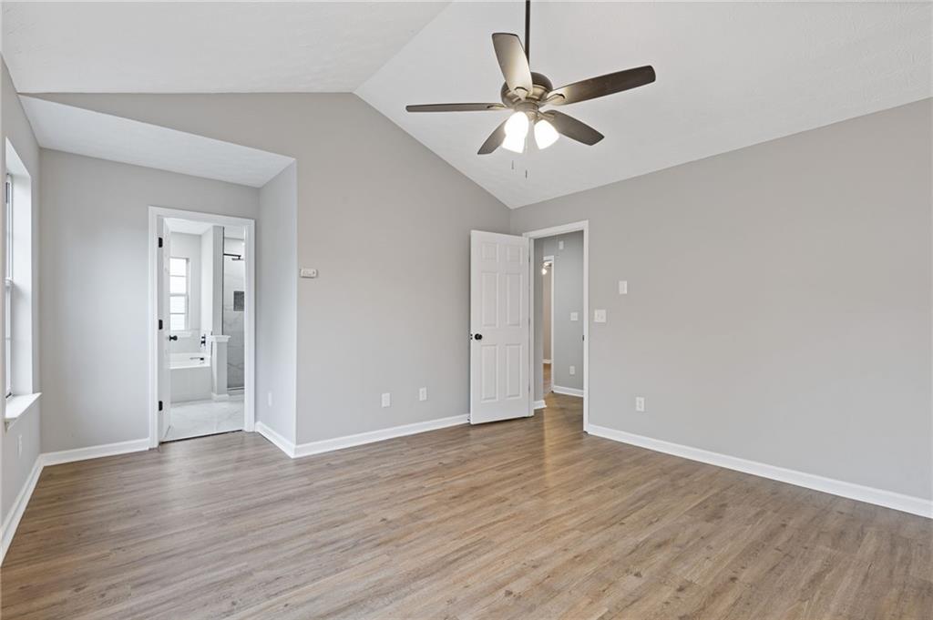 441 Spring Head Court Lawrenceville, GA 30046 - Photo 16 of 27 a view of an empty room with wooden floor
