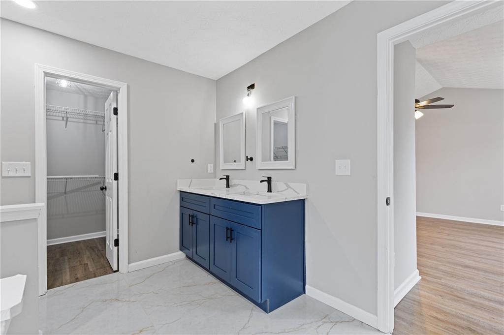 441 Spring Head Court Lawrenceville, GA 30046 - Photo 17 of 27 a bathroom with a sink and a mirror