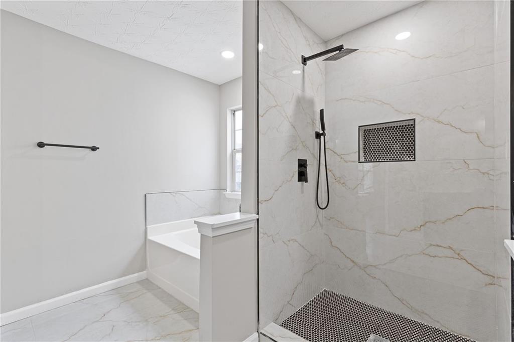441 Spring Head Court Lawrenceville, GA 30046 - Photo 18 of 27 a bathroom with a shower