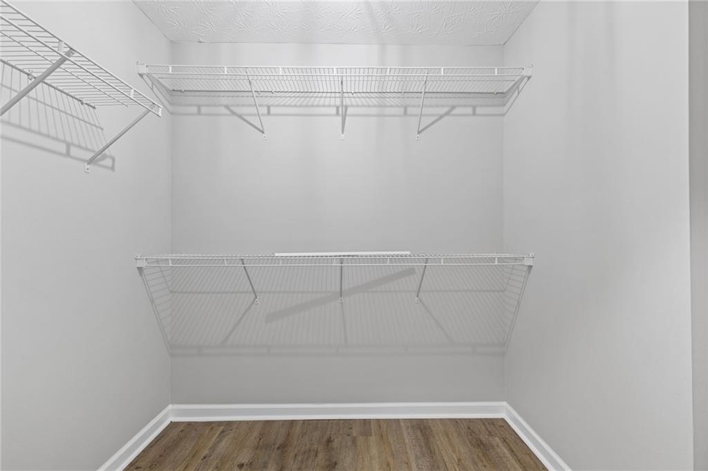 441 Spring Head Court Lawrenceville, GA 30046 - Photo 19 of 27 a view of a room with racks on the wall