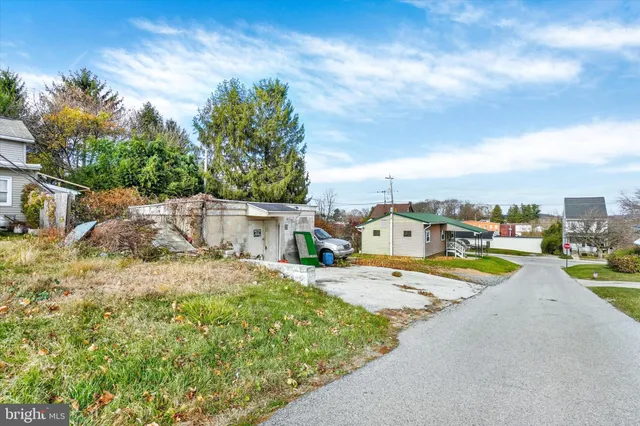 a view of a swimming pool with a yard