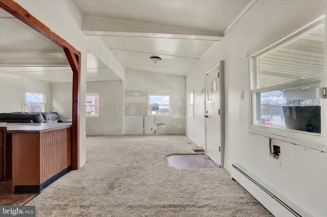 a bathroom with a mirror and a sink