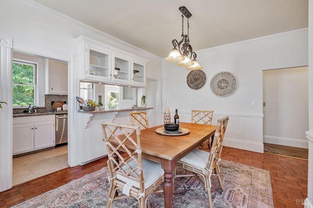 a dining room with furniture and window