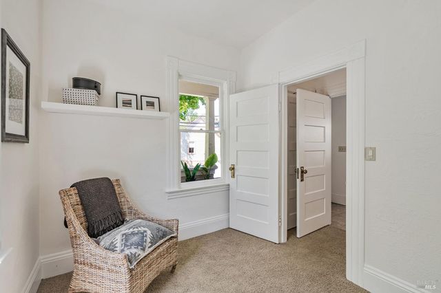 a living room with furniture and windows