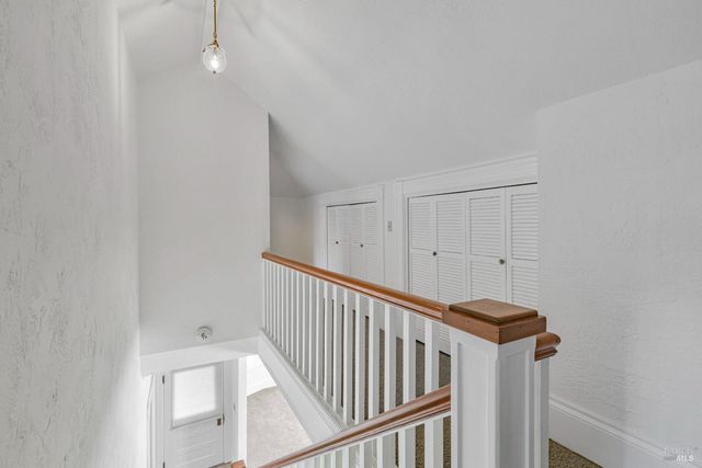 a view of a hallway with staircase
