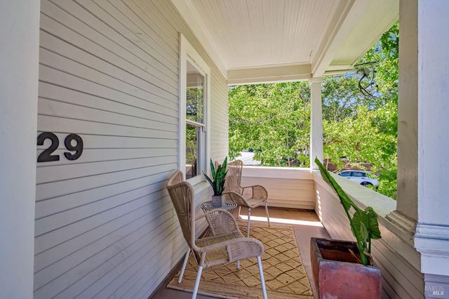 a view of an outdoor sitting area with furniture