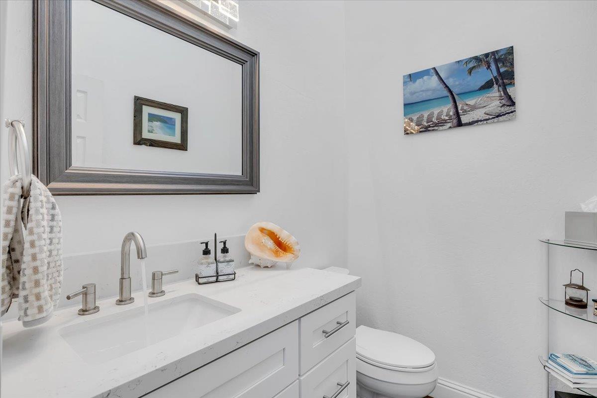 816 Foothill Road, Unit 2 Copperopolis, CA 95228 - Photo 14 of 99 a bathroom with a toilet a sink and mirror