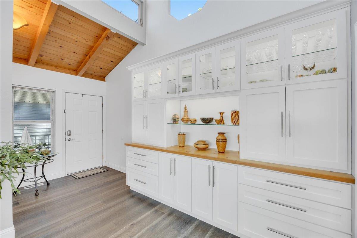 816 Foothill Road, Unit 2 Copperopolis, CA 95228 - Photo 15 of 99 a kitchen with white cabinets and wooden floor