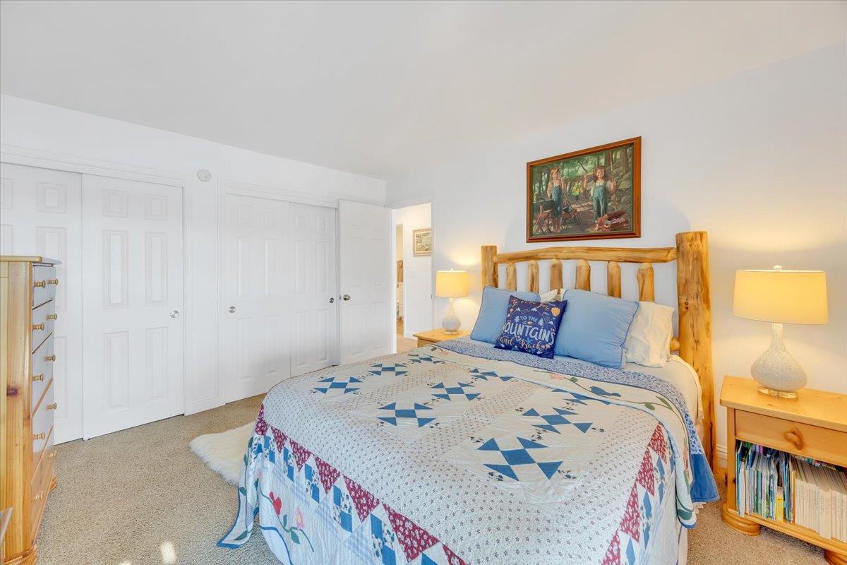 816 Foothill Road, Unit 2 Copperopolis, CA 95228 - Photo 59 of 99 a bed sitting in a bedroom next to a lamp