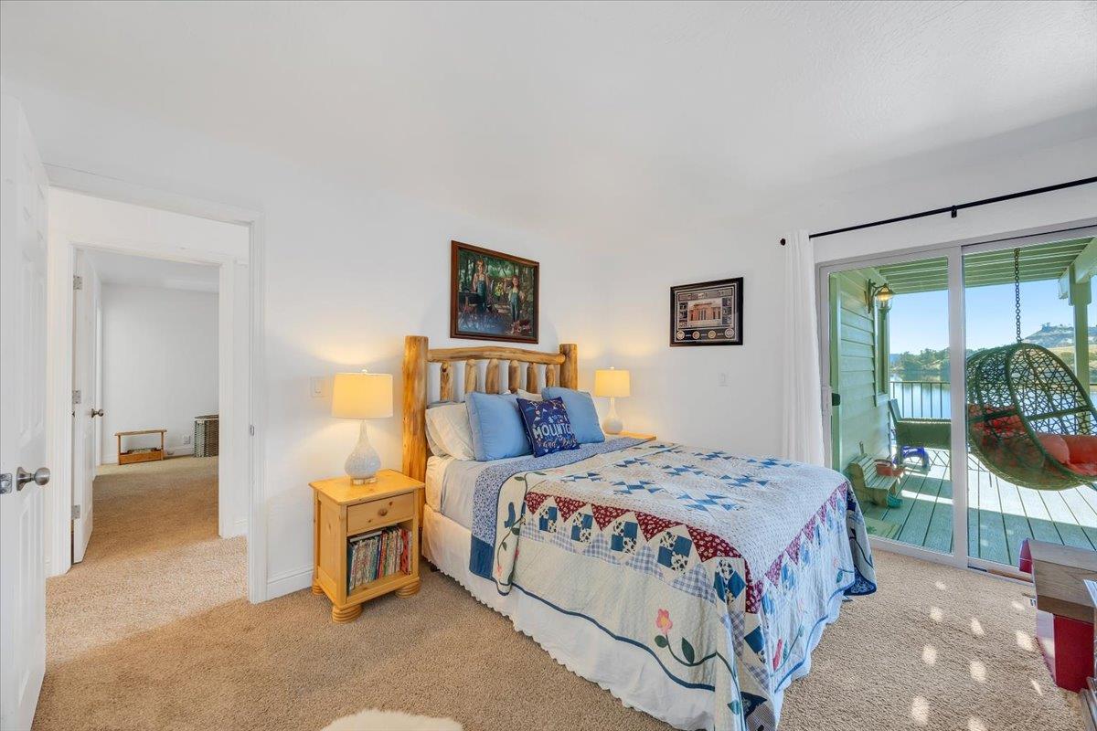 816 Foothill Road, Unit 2 Copperopolis, CA 95228 - Photo 60 of 99 a bedroom with a bed and a view of en suite bathroom