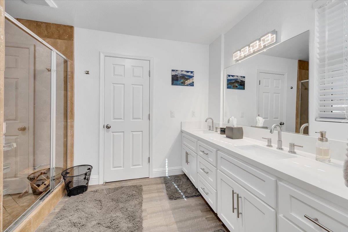 816 Foothill Road, Unit 2 Copperopolis, CA 95228 - Photo 62 of 99 a spacious bathroom with a double vanity sink and a mirror