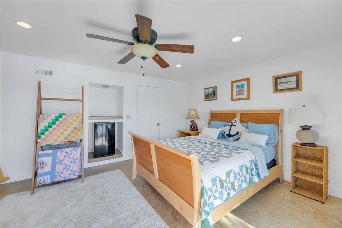 816 Foothill Road, Unit 2 Copperopolis, CA 95228 - Photo 78 of 99 a bedroom that has a bed and a chandelier