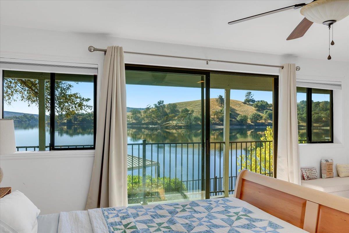 816 Foothill Road, Unit 2 Copperopolis, CA 95228 - Photo 79 of 99 a bedroom with a large window and a bed