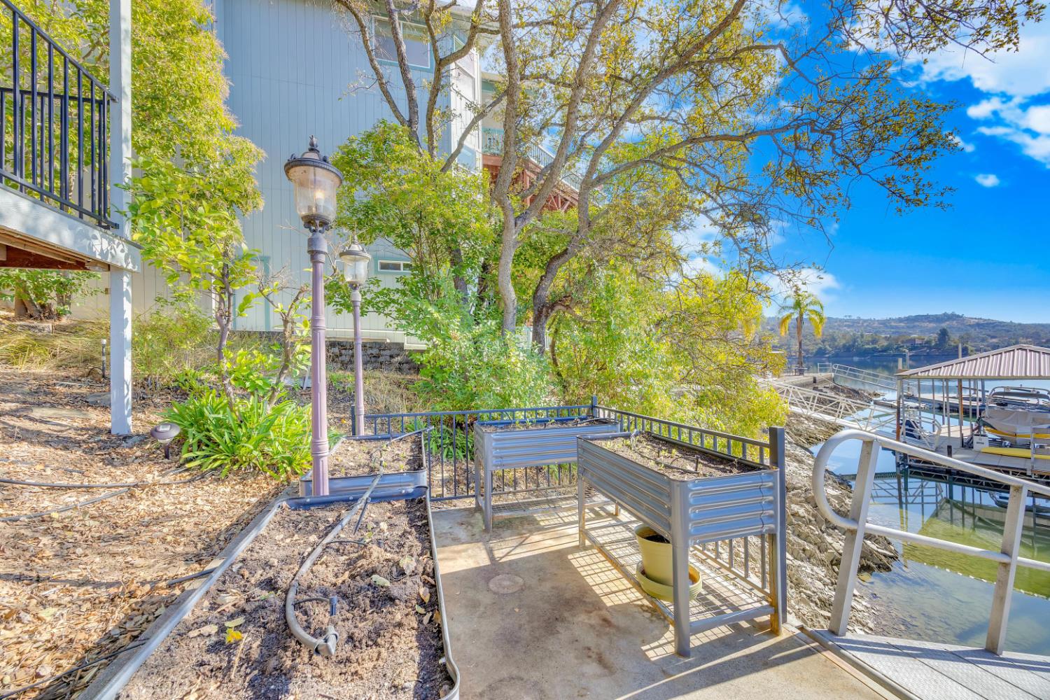 816 Foothill Road, Unit 2 Copperopolis, CA 95228 - Photo 83 of 99 a view of a patio with a table and chairs under an umbrella