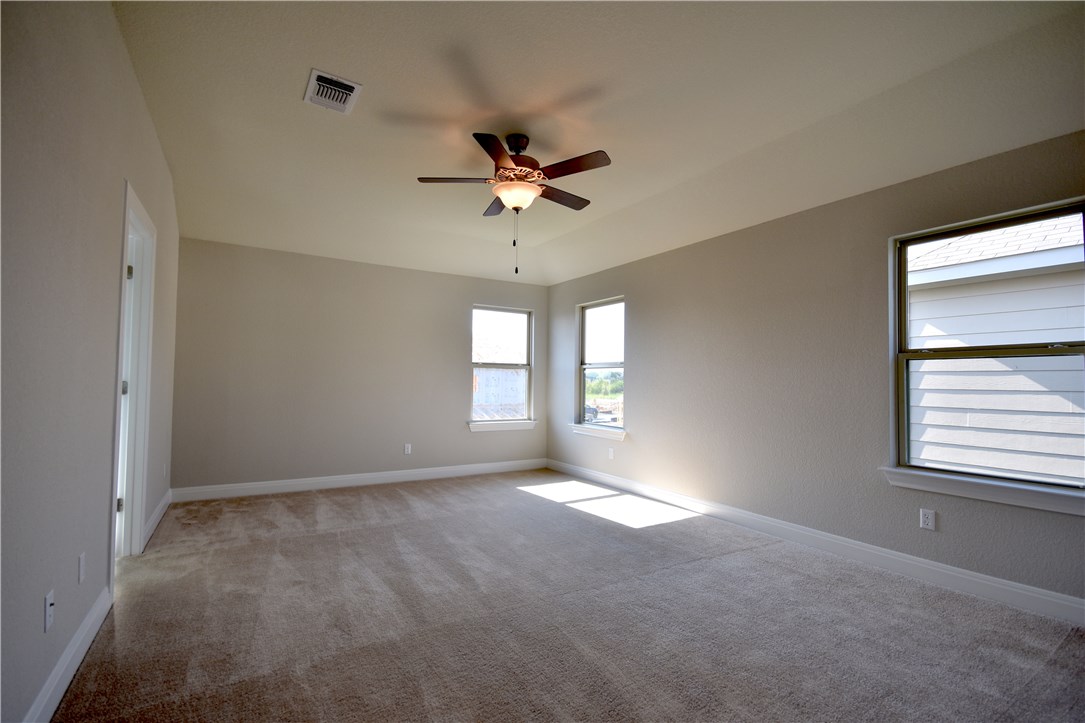 15911 Cessida Street Austin, TX 78728 - Photo 12 of 22 Master Bedroom with Ceiling Fan