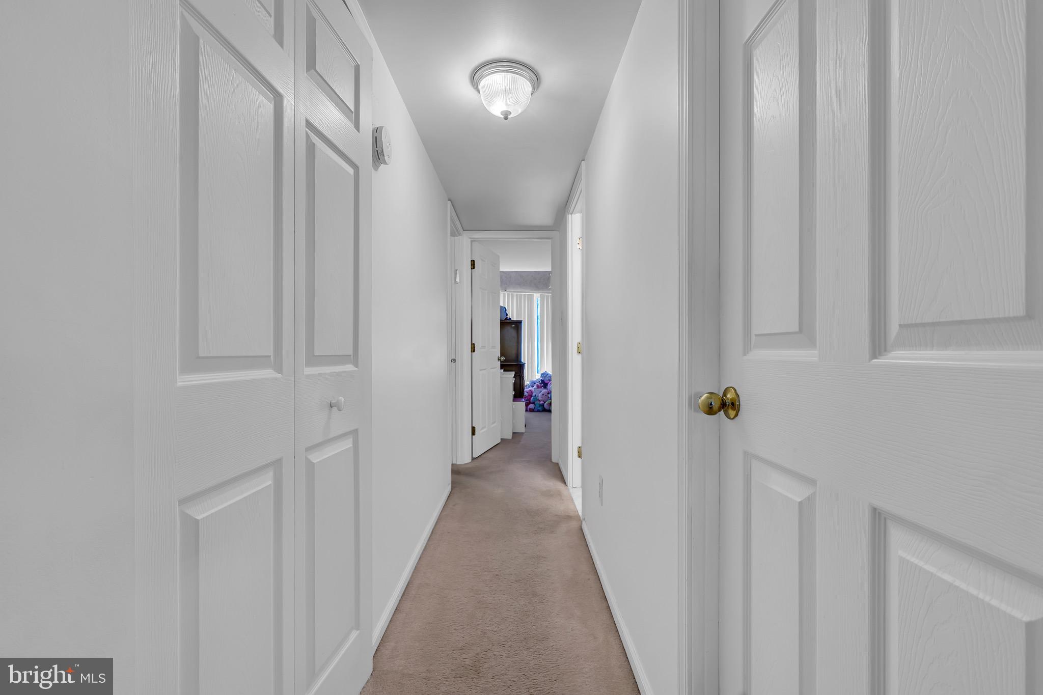 2015 Welsh Road, Unit A22 Philadelphia, PA 19115 - Photo 13 of 27 a view of a hallway with wooden floor and entryway