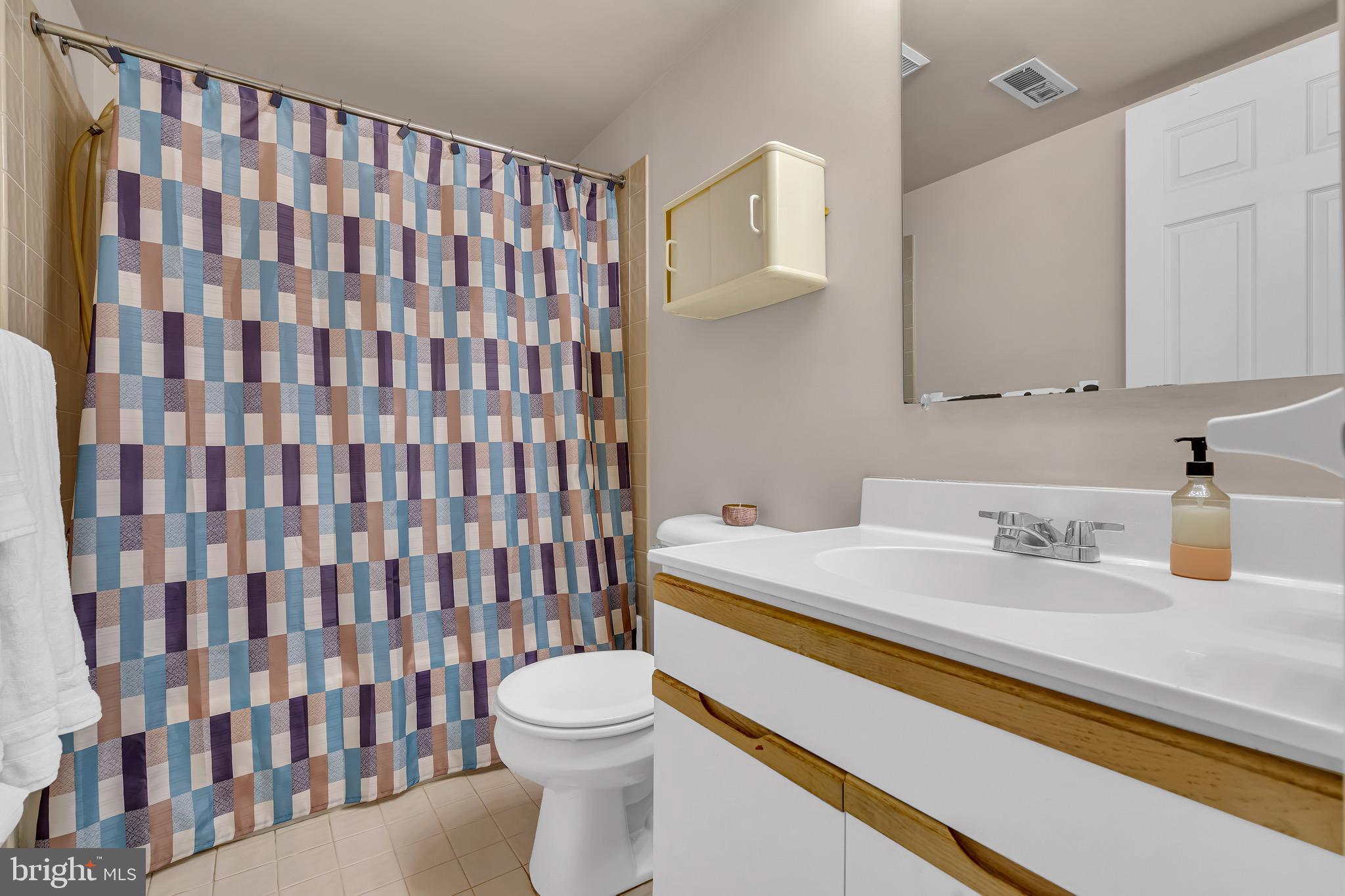 2015 Welsh Road, Unit A22 Philadelphia, PA 19115 - Photo 15 of 27 a bathroom with a sink toilet and shower