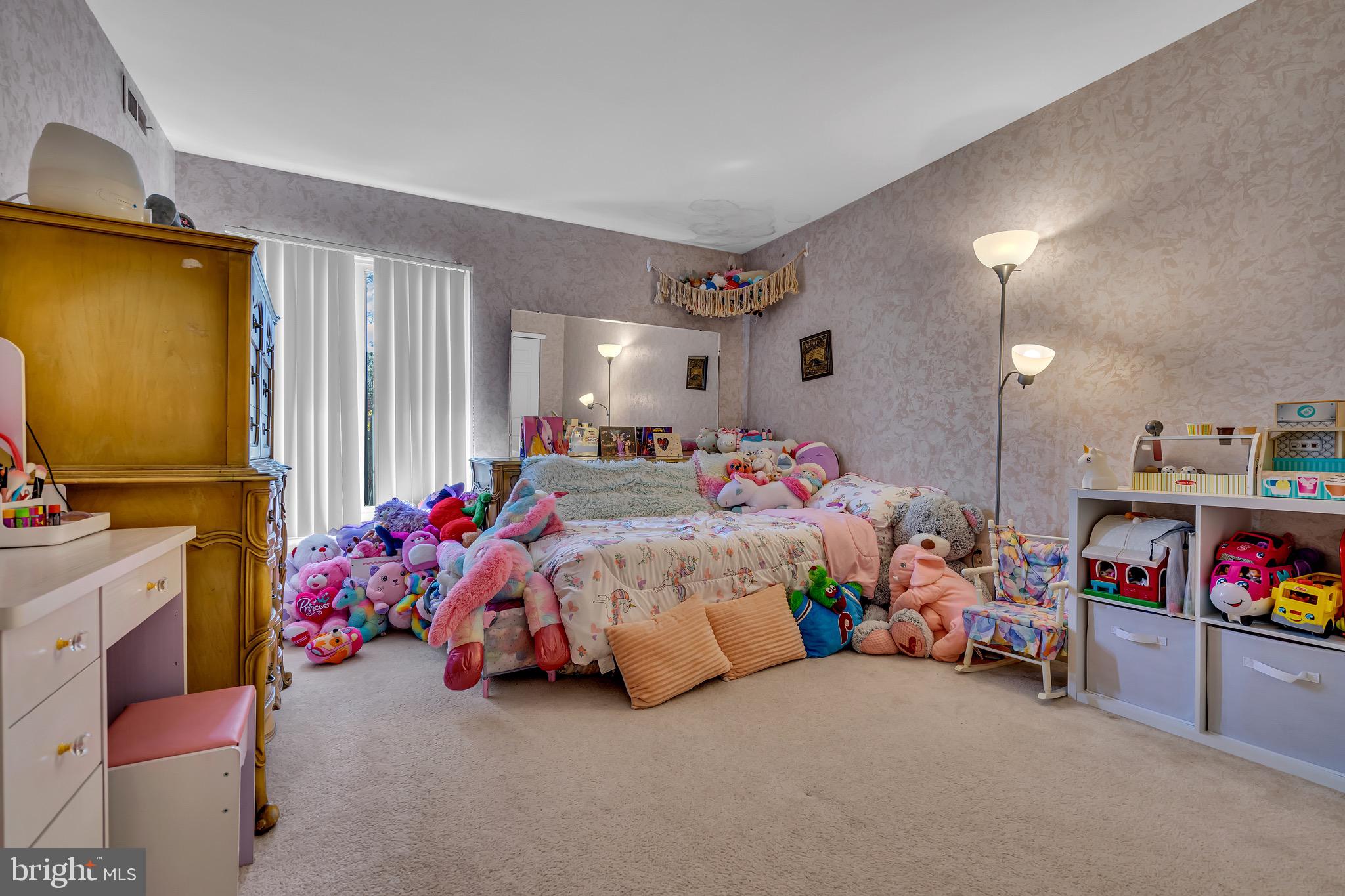 2015 Welsh Road, Unit A22 Philadelphia, PA 19115 - Photo 16 of 27 a bed room with a bed and a baby crib