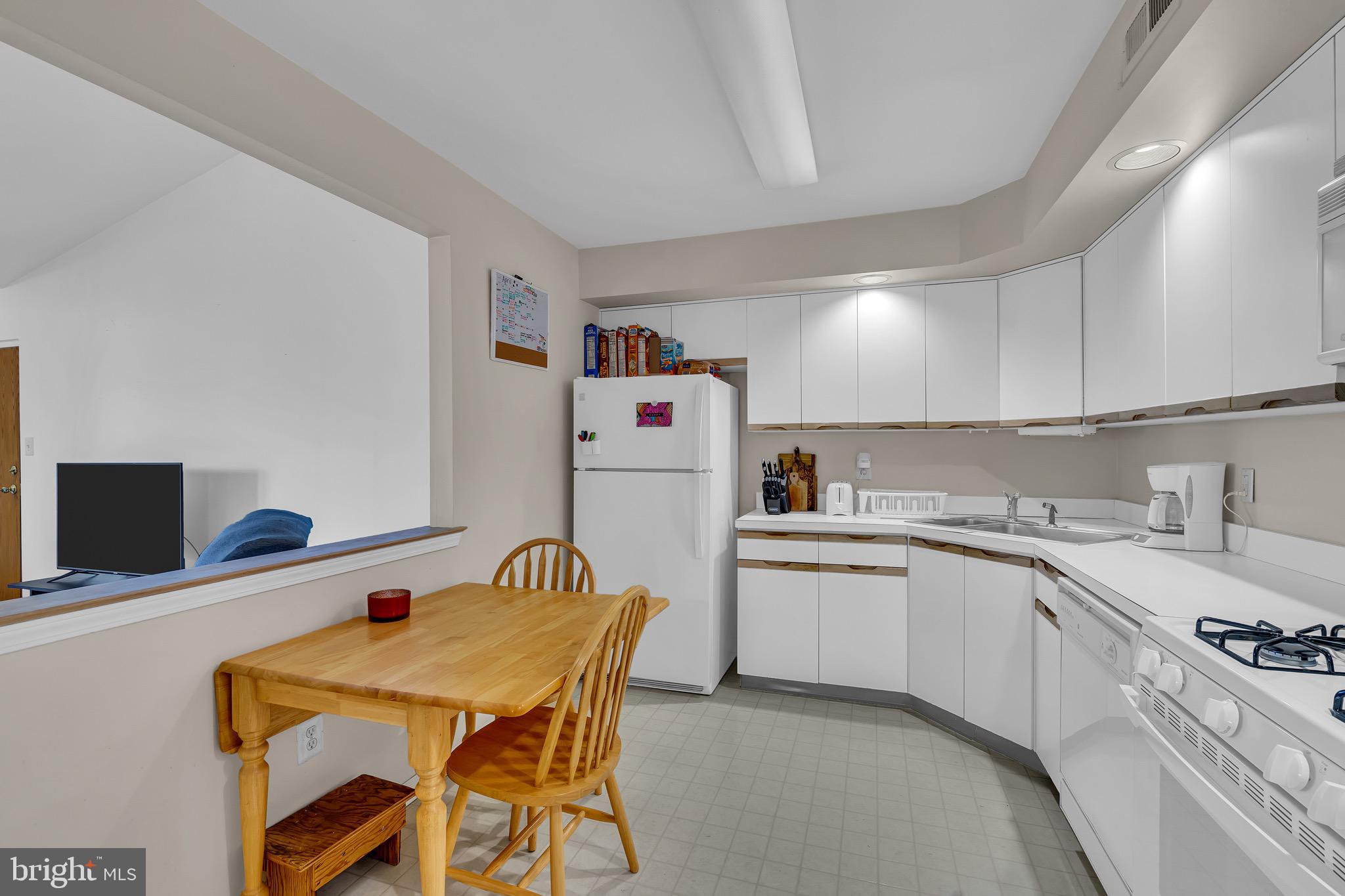 2015 Welsh Road, Unit A22 Philadelphia, PA 19115 - Photo 10 of 27 a kitchen that has a cabinets and a stove