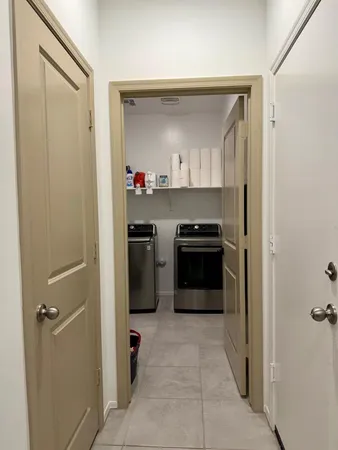 a kitchen with stainless steel appliances granite countertop a refrigerator and a stove