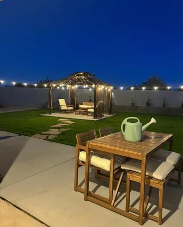 a view of a dining room with furniture and a yard