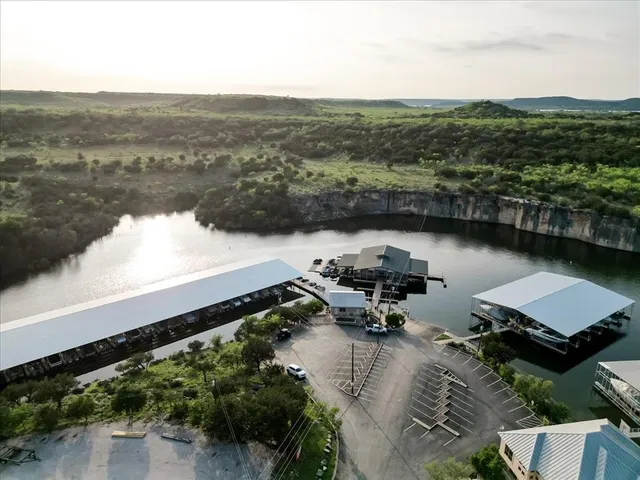 an aerial view of a house with a lake view