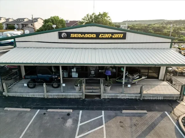 a view of a patio with table and chairs