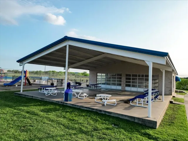 a view of a backyard with sitting area and furniture