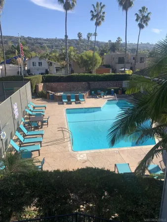 a view of a swimming pool with a yard