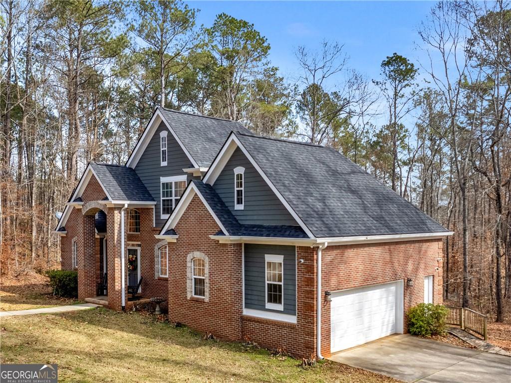 355 Parker Road Covington, GA 30014 - Photo 2 of 60 a front view of a house with a yard