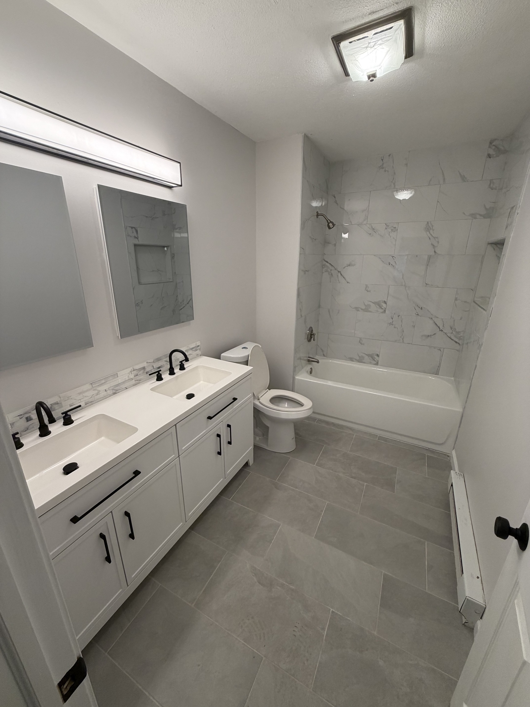 34 Pleasant Street, Unit 3 Plainfield, CT 06374 - Photo 6 of 10 a bathroom with a bathtub sink and toilet