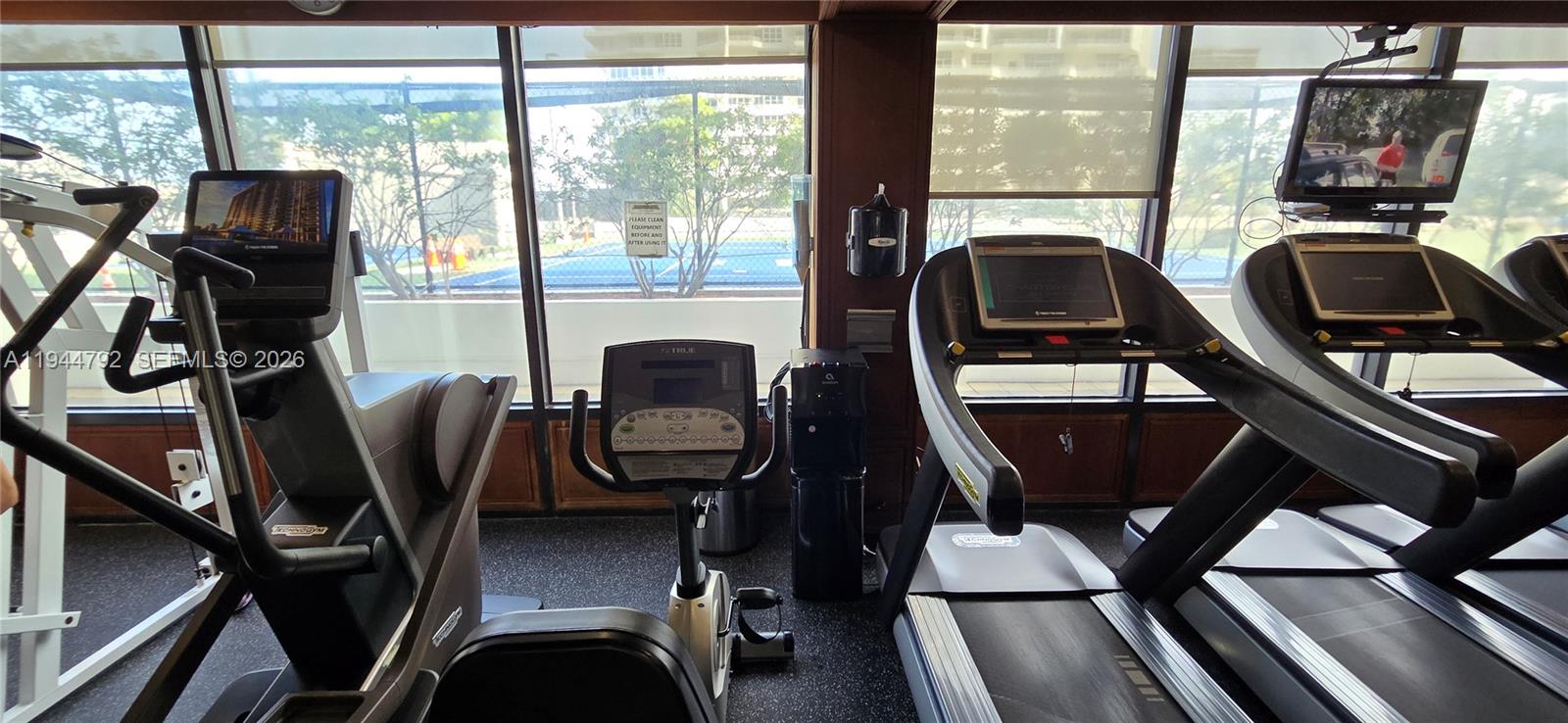 600 Northeast 36th Street, Unit 1509 Miami, FL 33137 - Photo 19 of 21 a view of a workspace with furniture and a window