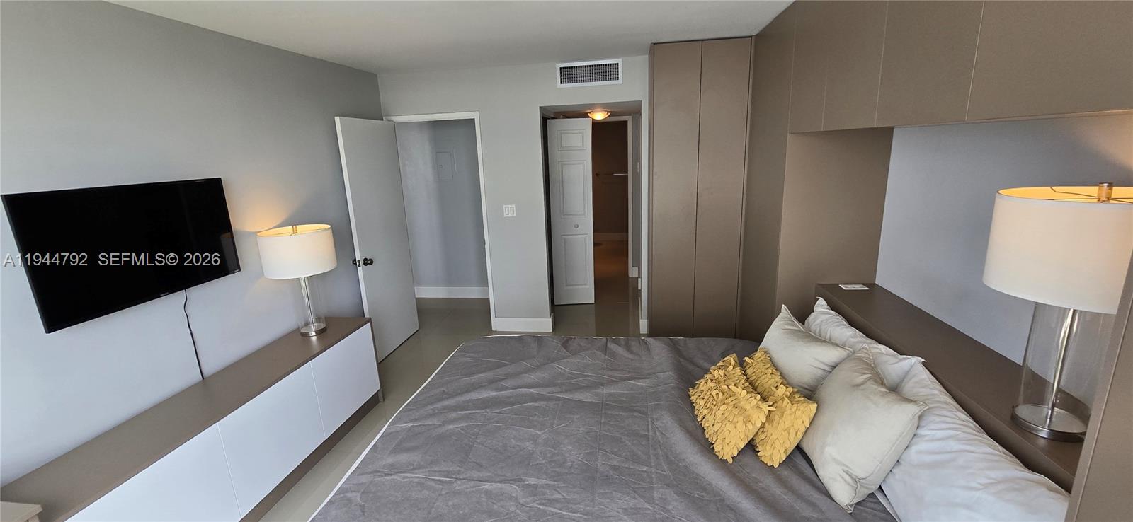 600 Northeast 36th Street, Unit 1509 Miami, FL 33137 - Photo 6 of 21 a view of living room with furniture and a flat screen tv