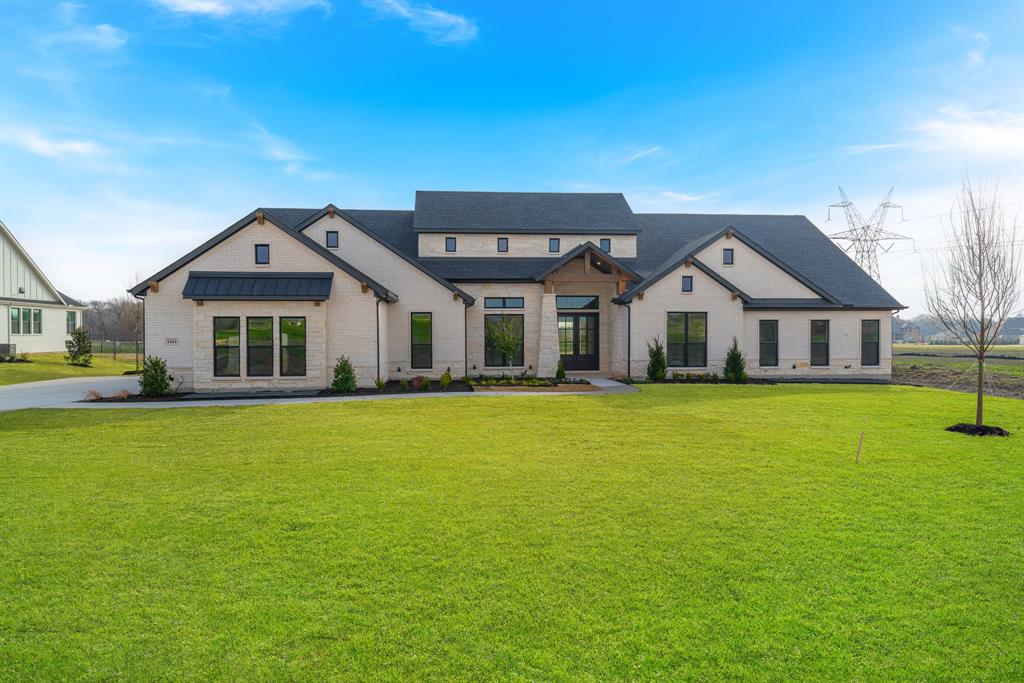 1441 Enchanted Way Lucas, TX 75002 - Photo 1 of 1 a front view of a house with a garden