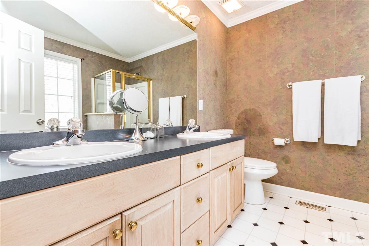 4233 Fowler Ridge Drive Raleigh, NC 27616 - Photo 11 of 28 Large tub with separate shower and dual vanity in master bath.