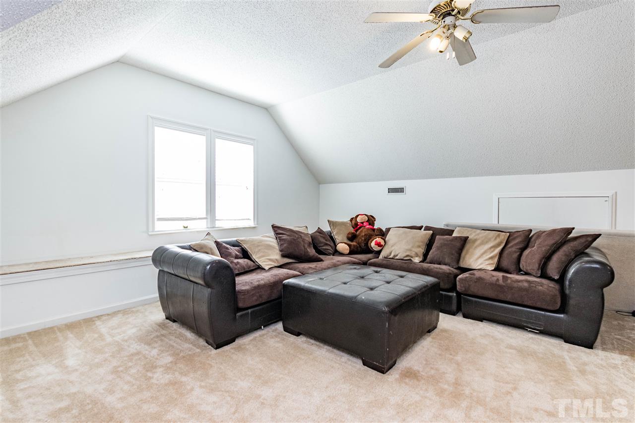 4233 Fowler Ridge Drive Raleigh, NC 27616 - Photo 16 of 28 Large Bonus Room with built in wall seating