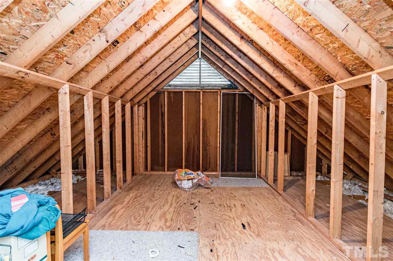4233 Fowler Ridge Drive Raleigh, NC 27616 - Photo 20 of 28 Great walk in attic storage space. Off the Bonus Room