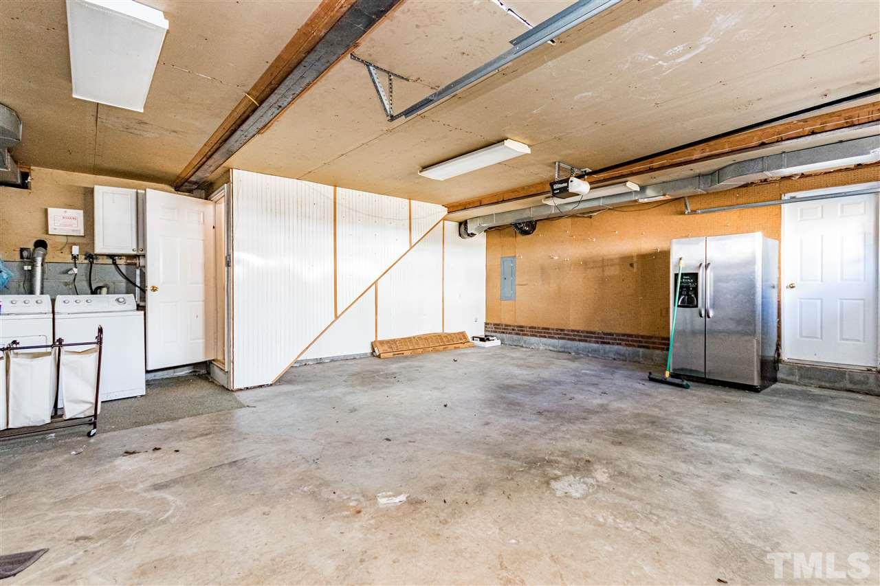4233 Fowler Ridge Drive Raleigh, NC 27616 - Photo 25 of 28 Spacious garage with laundry area.